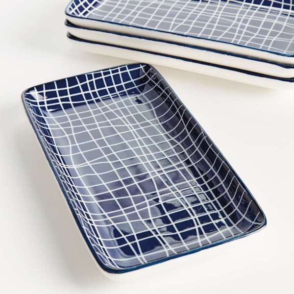 Rectangular ceramic trays with blue grid pattern on a white background