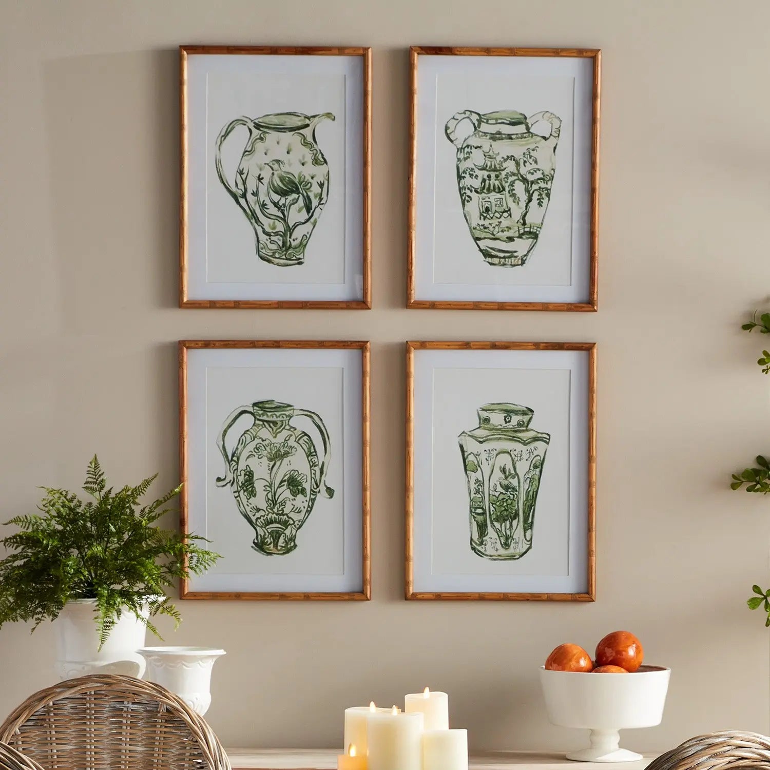 A set of four matted wall art prints featuring traditional chinoiserie jars in a monochromatic green color, encased in light-toned natural Chinese fir wood frames with glass.