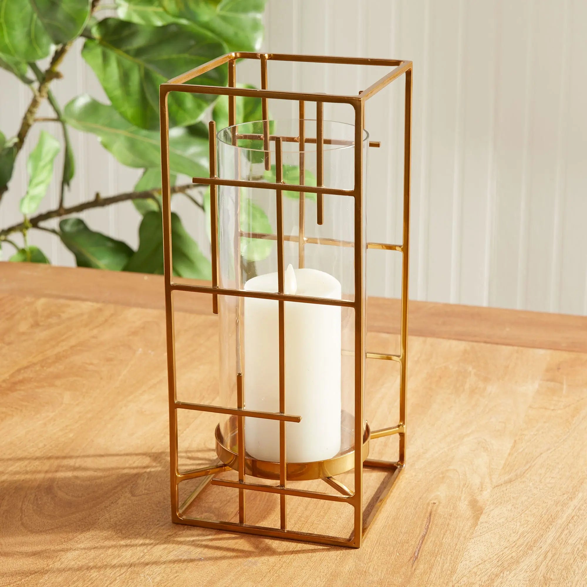 Geometric Gold Hurricane with Mondrian inspired iron lines and clear glass insert on a modern console – Villa Decor & Design