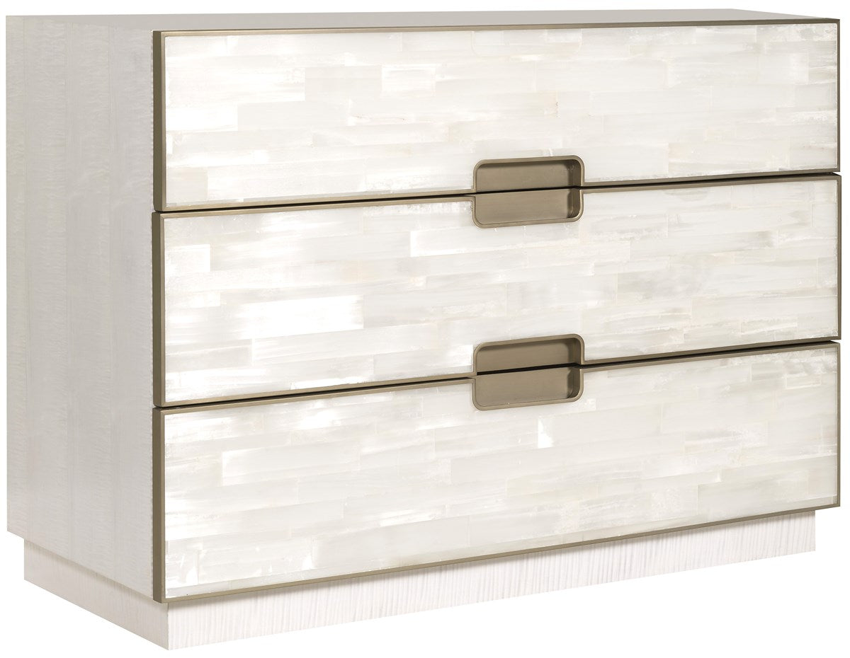 Splendor Selenite Chest, a three-drawer low dresser with drawer fronts faced in natural white selenite, a bleached maple case, and thin soft bronze metal accents.