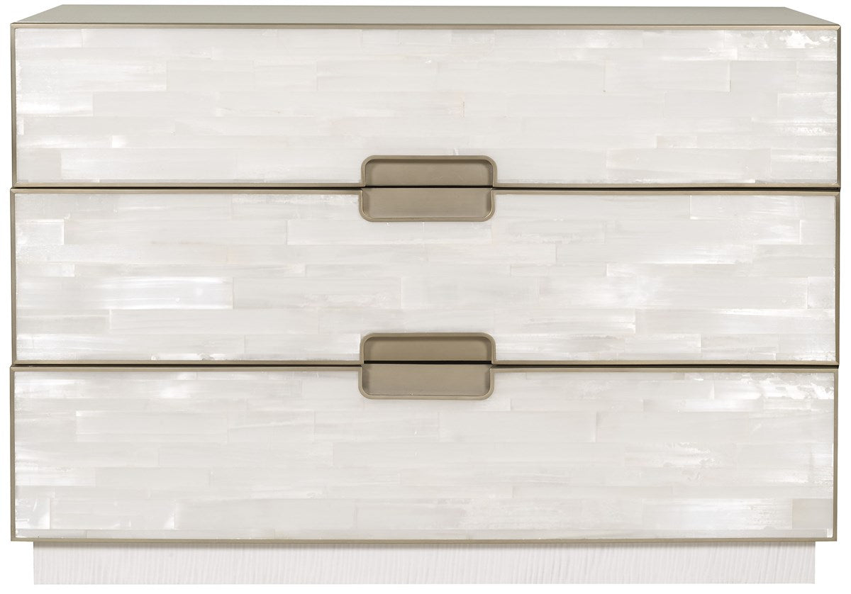 Splendor Selenite Chest, a three-drawer low dresser with drawer fronts faced in natural white selenite, a bleached maple case, and thin soft bronze metal accents.