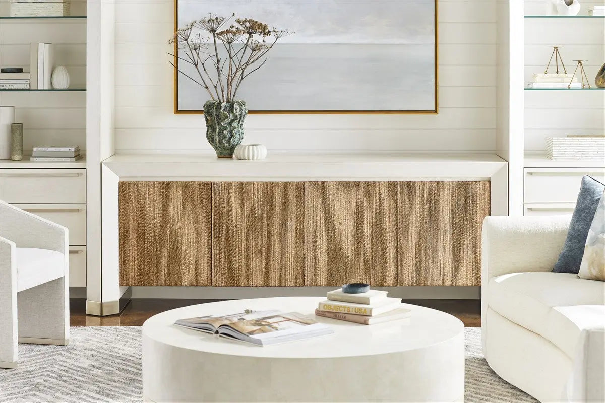 Dunecrest Dining Chair, an upholstered dining chair with arms, covered in light Nomad Snow fabric and featuring a modern Cava wood finish.