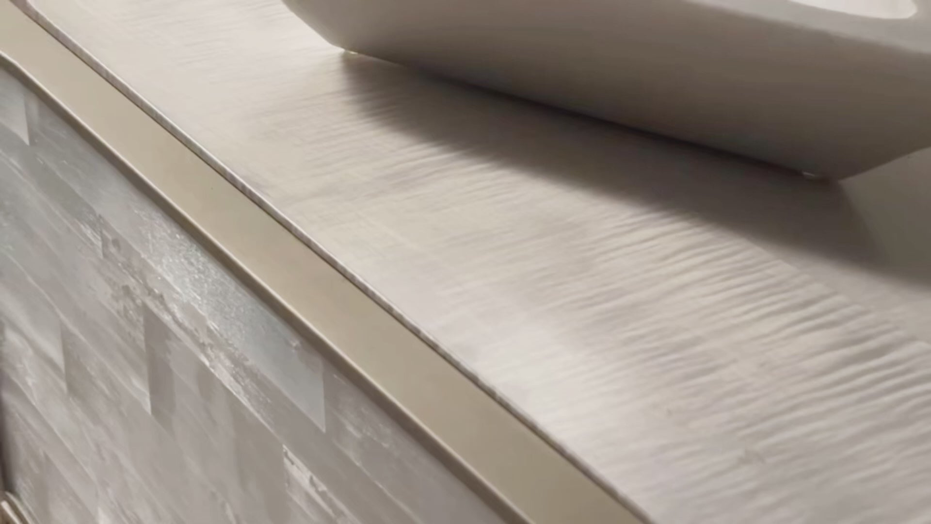 Splendor Selenite Chest, a three-drawer low dresser with drawer fronts faced in natural white selenite, a bleached maple case, and thin soft bronze metal accents.